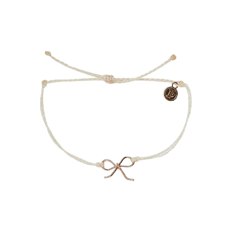 Bracelets with raw moonstone for mystic beauty -Pura Vida Bow Charm Rose Gold Bracelet