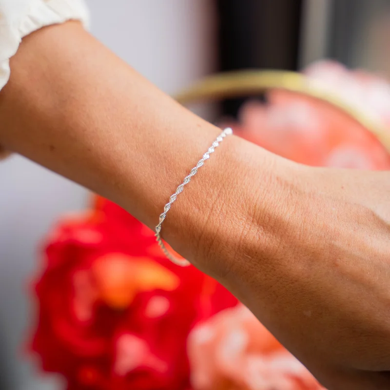 Bangles with gothic-inspired engravings for drama -TWIRL - Sterling Silver Twisted Accent Bracelet